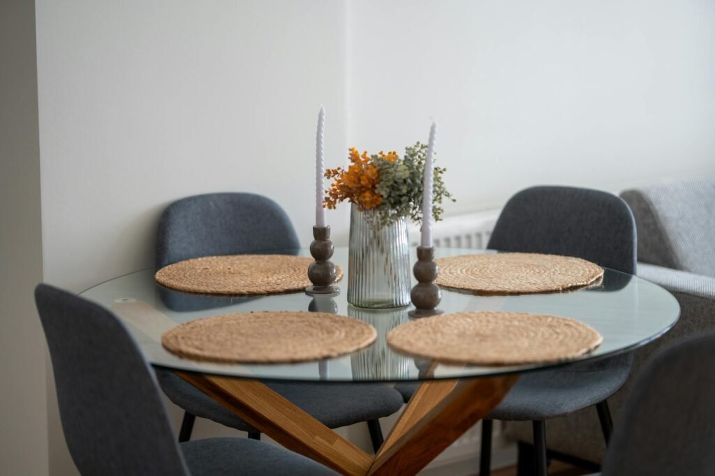 A simple dining table with a low centerpiece and no clutter