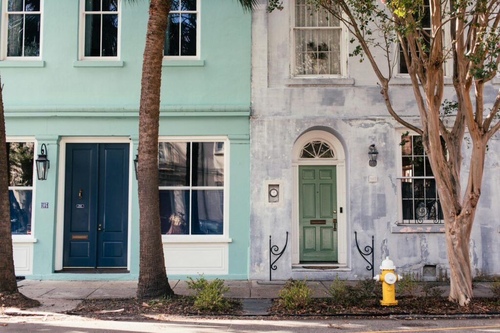 A clean front entry with planters, a swept walkway, and tidy front door details.