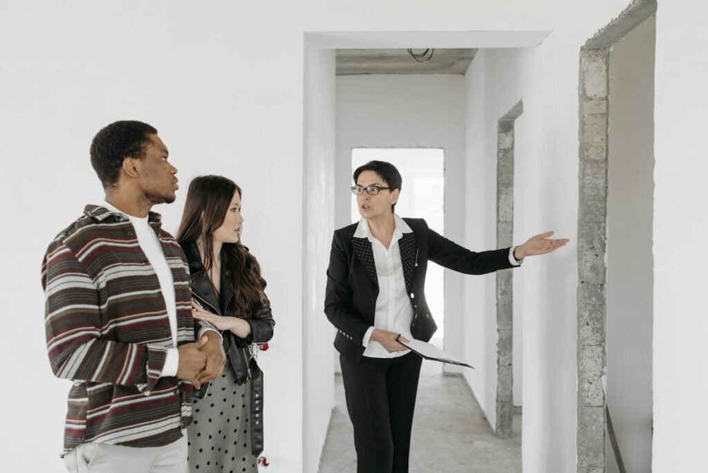 A homeowner using a phone to record a walk-through of the entryway.